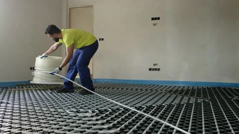 Radiant floor installer, man working and revising Stock Footage 218180218