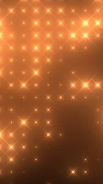 Radiant golden star pattern on a warm amber background, creating a festive an Stock Photos