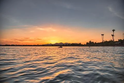 Radiant Sunset &amp; Lake Reflection Stock Photos