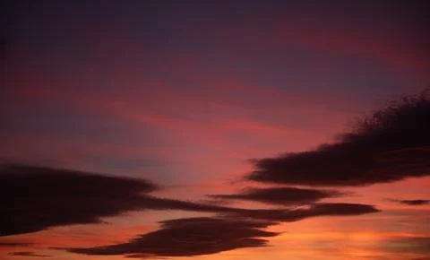 Radiant Sunset Sky with Vibrant Cloudscape Stock Photos