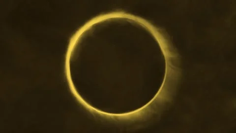 Radiant yellow solar eclipse ring glowing in darkness with ethereal Stock Footage 310254705