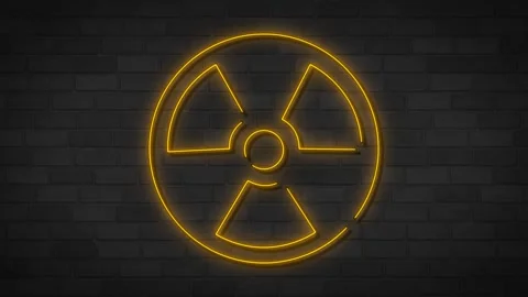 Radiation neon sign on brick wall. Nuclear warning. Stock Footage 265702196