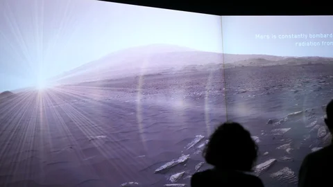 Radiation on red planet Mars surface atmosphere. People watch futuristic clips. Stock Footage 124426175