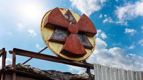 Radiation sign with clouds on background Stock Footage 114955962