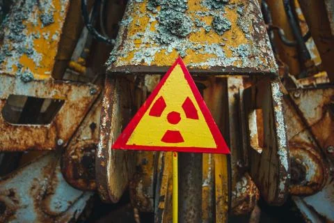 Radiation Sign - triangular warning yellow sign of radiation hazard in the zone Stock Photos
