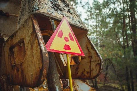 Radiation Sign - triangular warning yellow sign of radiation hazard in the zone Stock Photos