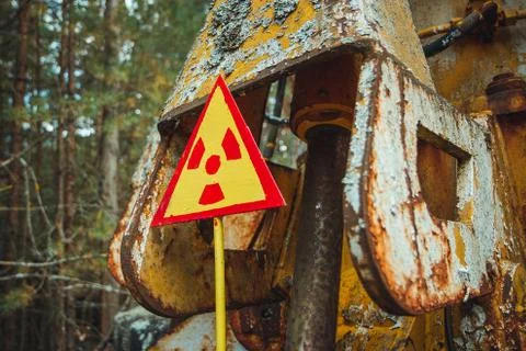 Radiation Sign - triangular warning yellow sign of radiation hazard in the zone Stock Photos