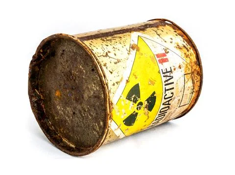 Radiation warning sign on the rusty old cylinder shape container of Radioac.. Stock Photos
