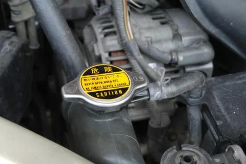 Radiator cap with warning label Stock Photos