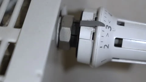 Radiator thermostat positioned at mid-level setting, showing moderate heating Stock Footage 322136107