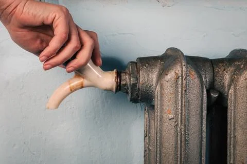 Radiator venting and control. Heating costs concept Stock Photos