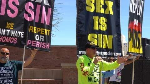 Radical bigots protesting Phoenix Pride LGBTQ Parade Stock Footage 122081378