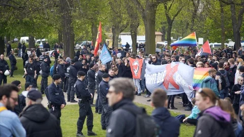 Radical left Antifascist protest, flags banners, police officer line, Berlin Stock Footage 87455288