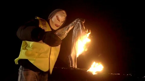 Radical Protestant in the mask represents the protesters against the authorities Stock Footage 104179946