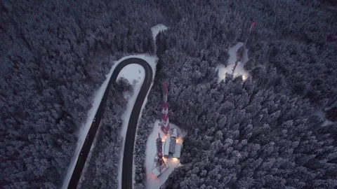 Radio cell tower in a winter forest with snow covered trees, 5g transmission Stock Footage 254510800