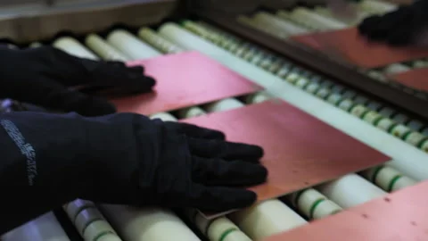 Radio Components Production. Operator Placing Group of Pieces on a Conveyor. Video stock 193931714