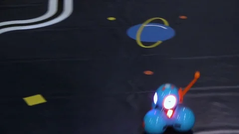 Radio-controlled bright mini robot moves fast, then slowly Stock Footage 81722751