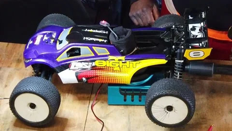 Radio Controlled Nitro Car Started On a Stand Stock Footage 220033755