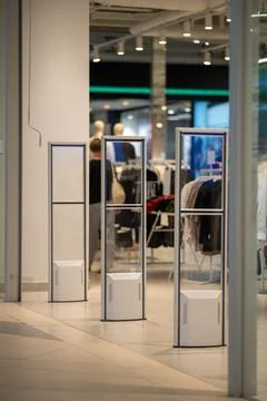 Radio-frequency security gates with integrated metal detector at a clothing.. Stock Photos