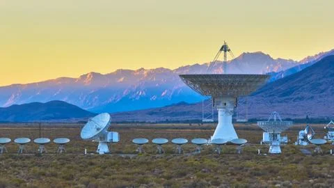 Radio Observatory Array at Sunrise with Satellite Dishes and Sierra Nevada Stock Photos