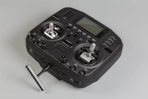 Radio remote control with screen display on a gray background 写真素材