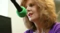 Radio show host at her microphone face with attentive expression HD видео футажи