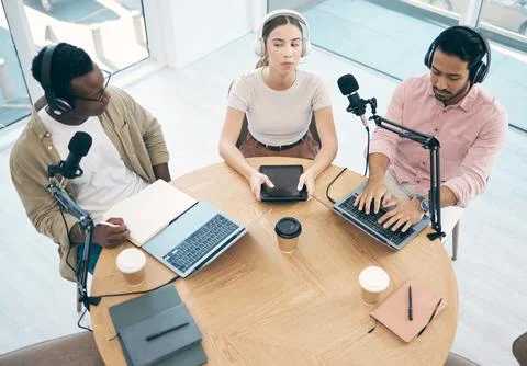 Radio, technology or broadcast with a content creator team in the office from Stock Photos