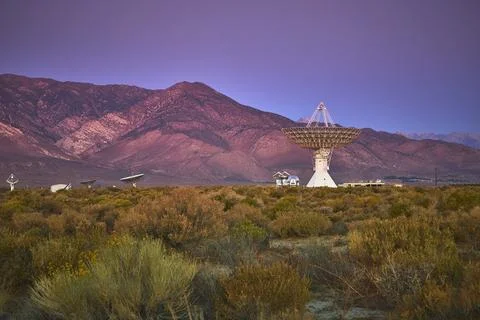 Radio Telescope Array and Observatory at Dusk with Mountains in Owens Valley Stock Photos