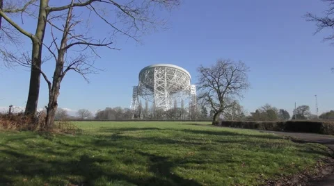 Radio telescope deep space jodrell bank blue sky zoom in Stock Footage 65341360