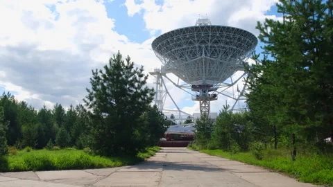 A radio telescope dish rotates during a scientific experiment Video stock 253624886