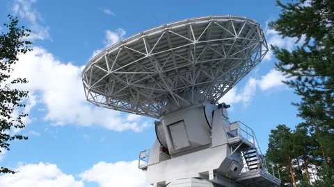 A radio telescope dish rotates during a scientific experiment Stock Footage 253626020