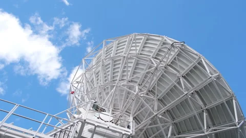 A radio telescope dish rotates during a scientific experiment 動画素材 253626300