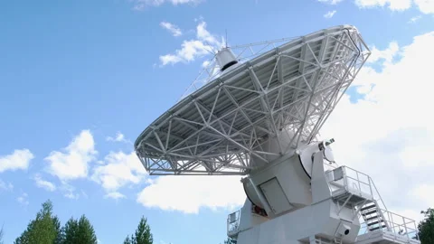 A radio telescope dish rotates during a scientific experiment Stock Footage 253626444