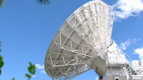 A radio telescope dish rotates during a scientific experiment Stock-Footage 253626643