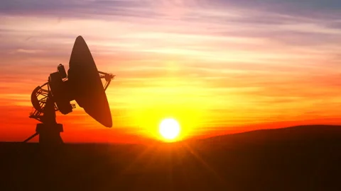 Radio telescope explores evening sky against scenic sunset Stock Footage 116015339