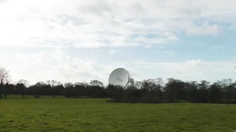 Radio telescope jodrell bank distant view moving clouds Stock Footage 47465154