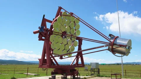 Radio telescope in an open area during the day Video stock 253624721