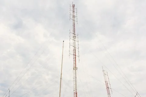 Radio tower with cloudy sky. Stock Photos