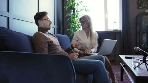 Radio worker having interview with guest in recording studio Stock-Footage 233624342