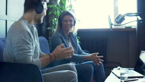 Radio worker having interview with guest in recording studio Stock-Footage 233624664