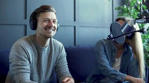 Radio worker having interview with guest in recording studio Stock-Footage 233624819