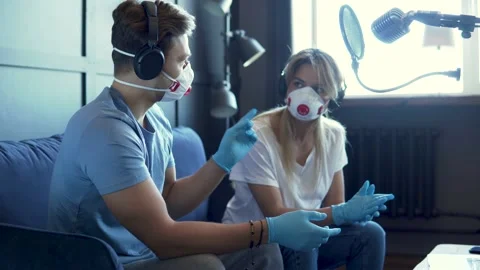 Radio worker having interview with guest in recording studio during pandemic Vídeo Stock 233625131