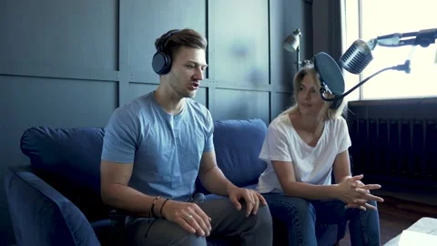 Radio worker having interview with guest in recording studio Stock-Footage 233625328