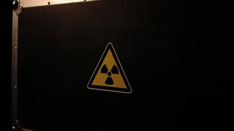 Radioactive danger warning symbol in triangular on a black case Video stock 116789500