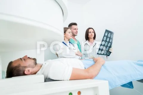 Radiology, surgery, people and medicine concept - female doctors looking to a Stock Photos