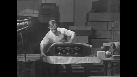 Radios are wrapped and boxed in the shipping department of a factory, in Long Stock Footage