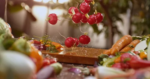 Radish falling on chopping board Stock Footage 311832986