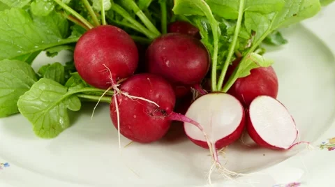 Radish on plate, rotating clockwise Stock Footage 63796039