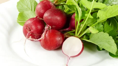 Radish on plate, rotating counter clockwise Stock Footage 63797851