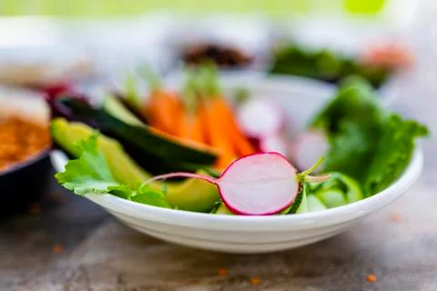 Radishes and raw seasonal vegetables. Vegetarian food. Stock Photos